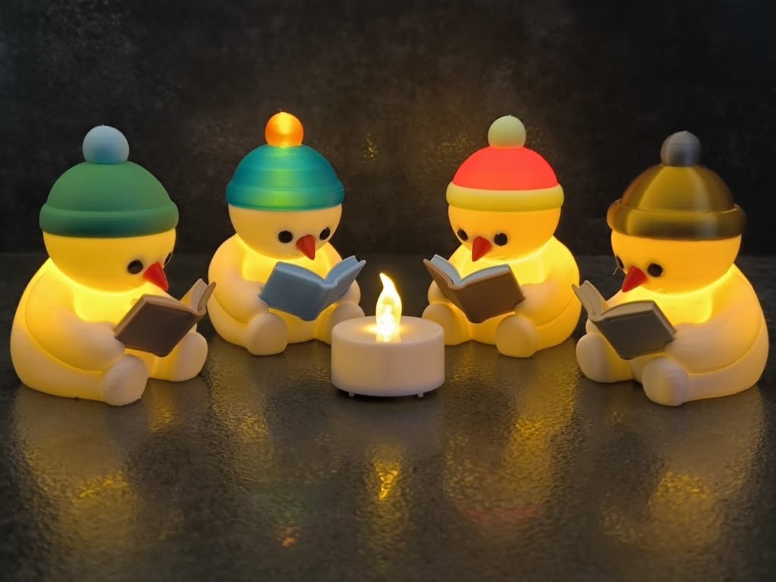 Cozy Reading Snowman LED Tealight Holder – Christmas Decor